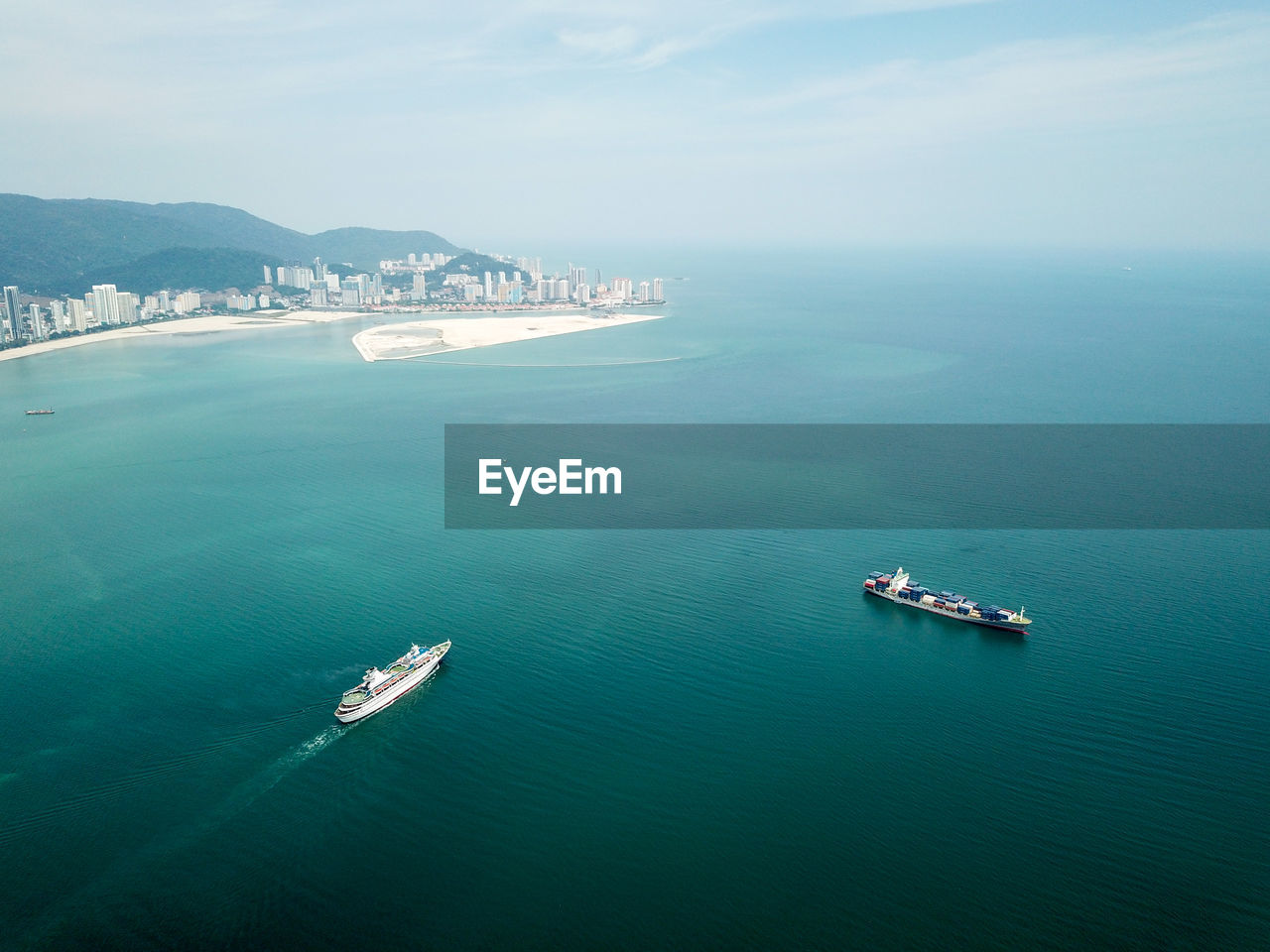 Aerial view of ships in sea against sky