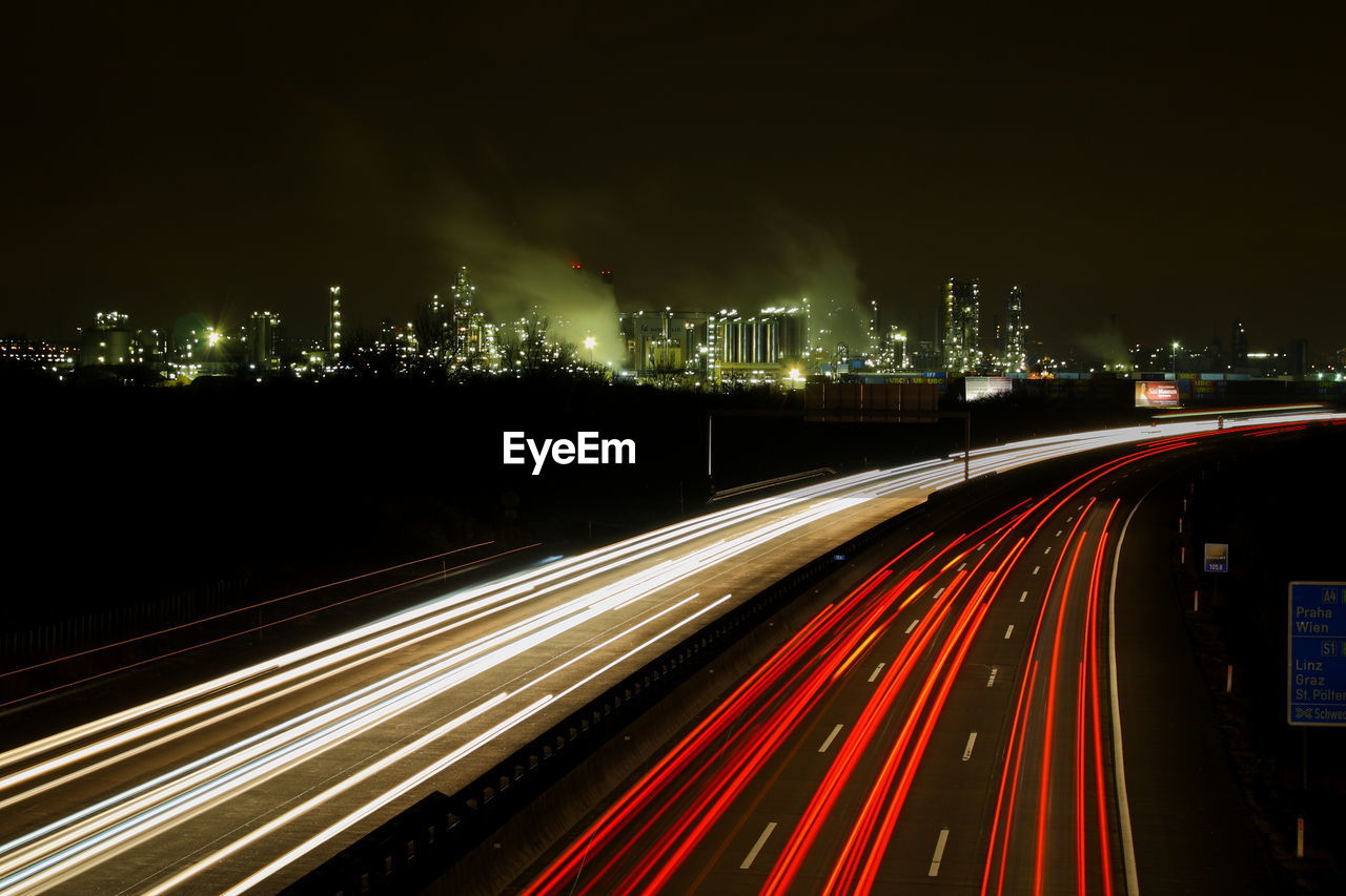 High angle view of light trails on road at night