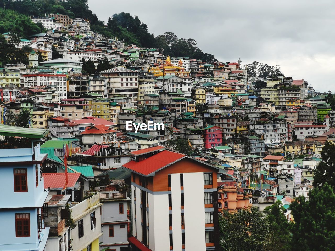 Houses in town against sky