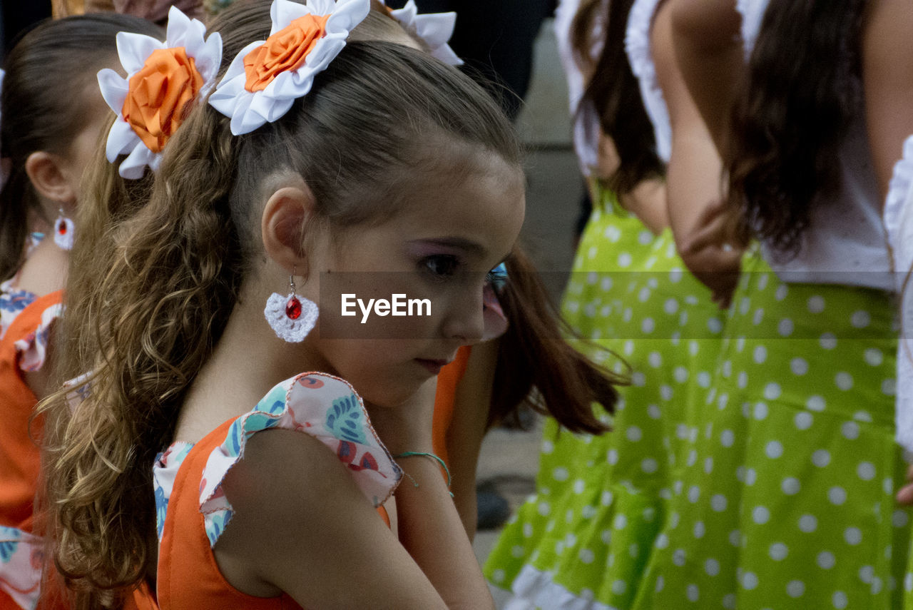 Side view of girl wearing earring outdoors