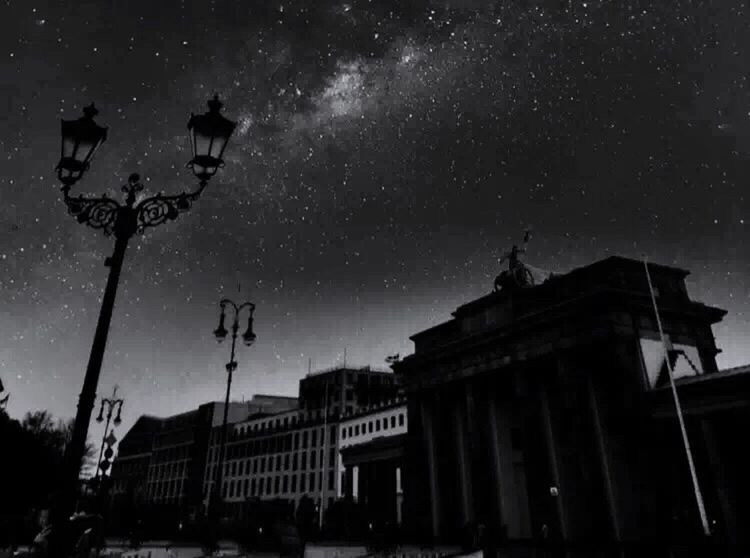 LOW ANGLE VIEW OF BUILDINGS AT NIGHT