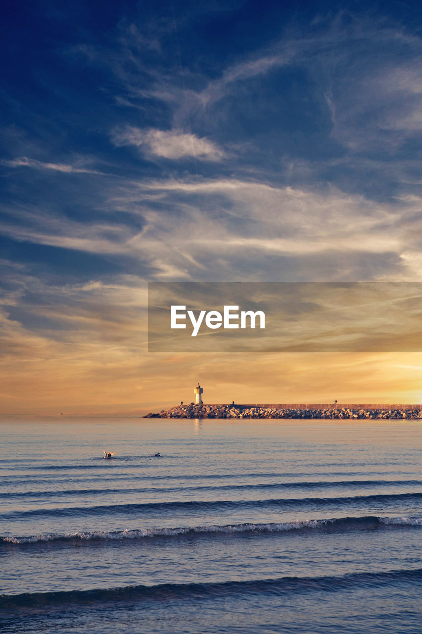 Scenic view of sea against sky during sunset