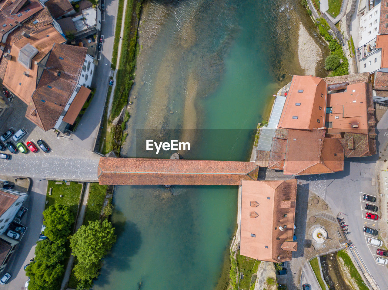 High angle view of covered bridge over river in city