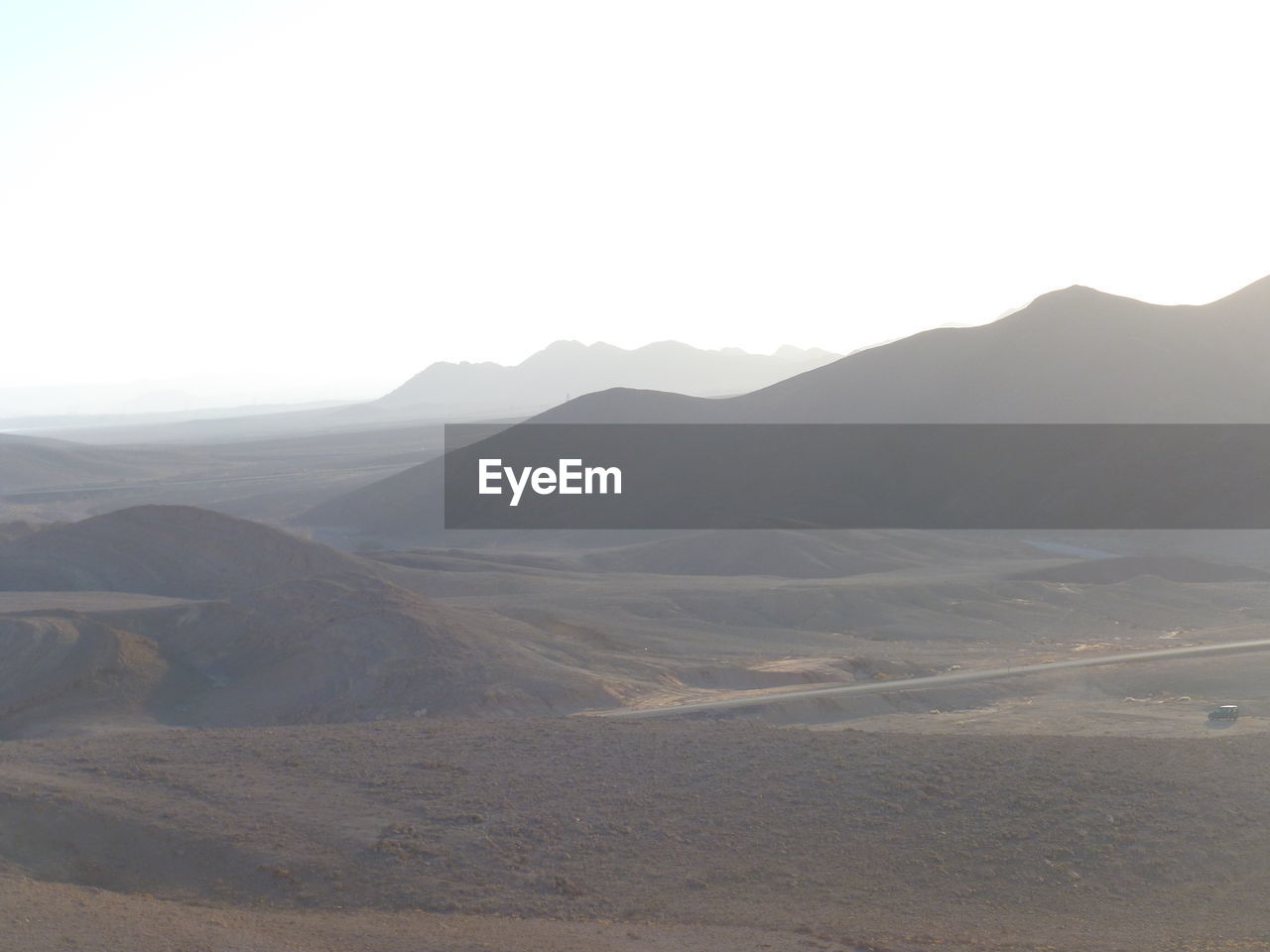 SCENIC VIEW OF ARID LANDSCAPE AGAINST CLEAR SKY