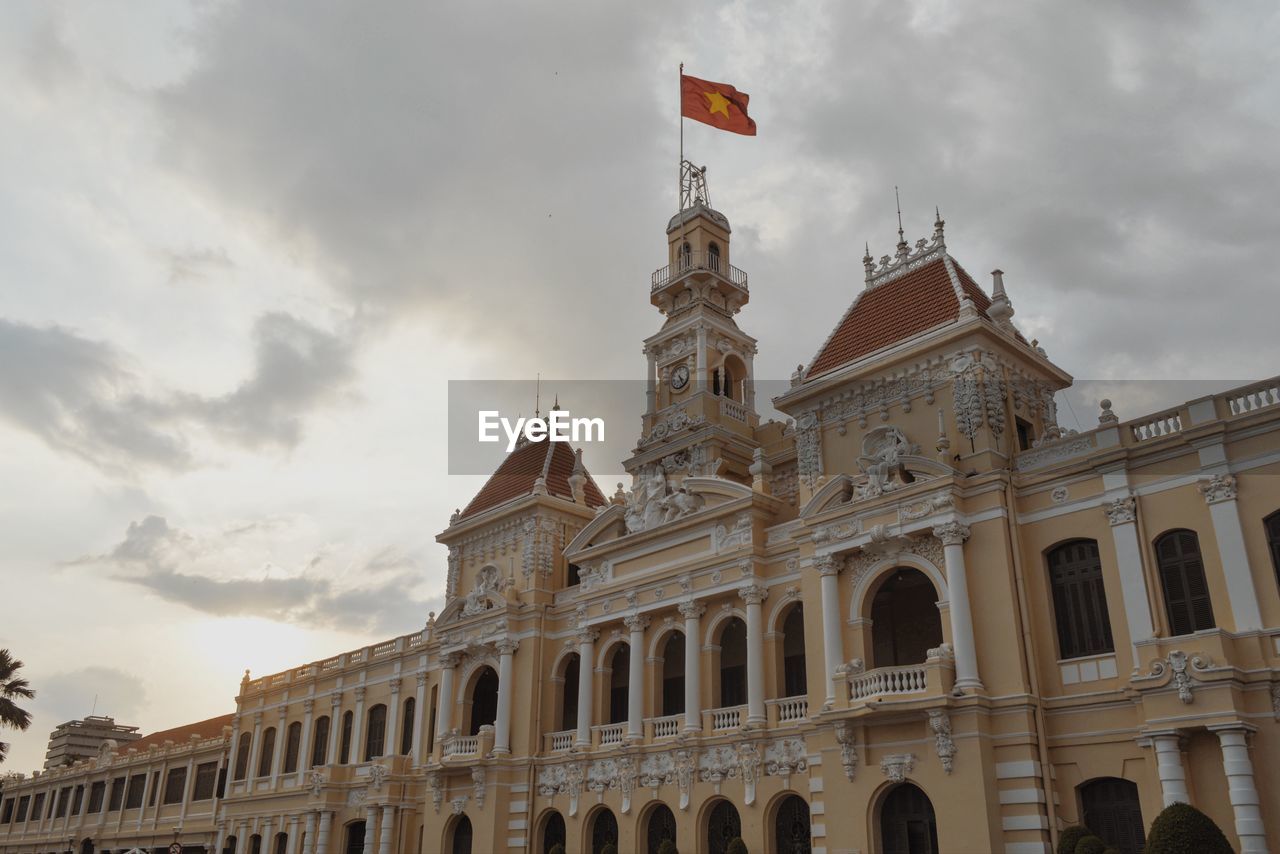 Low angle view of ho chi minh city hall against sky