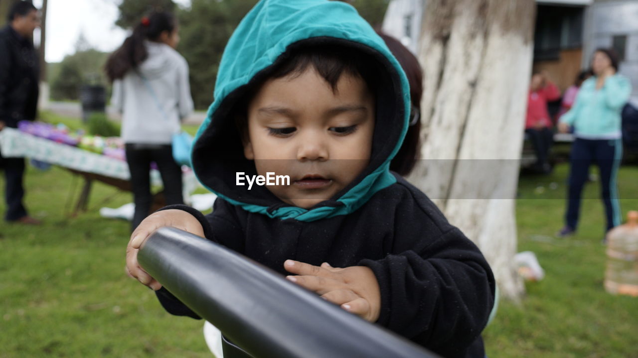 CLOSE-UP OF BOY IN PARK