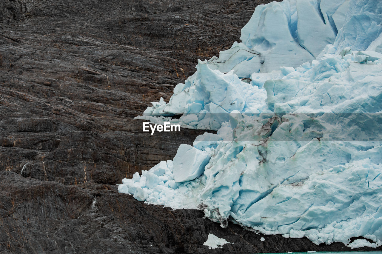 Close-up of ice against rock