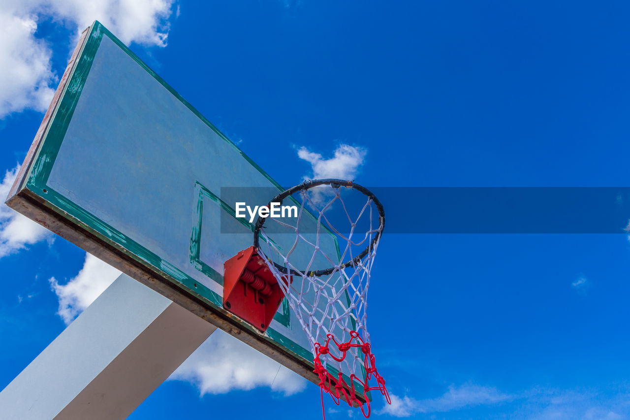 Low angle view of basketball hoop against sky