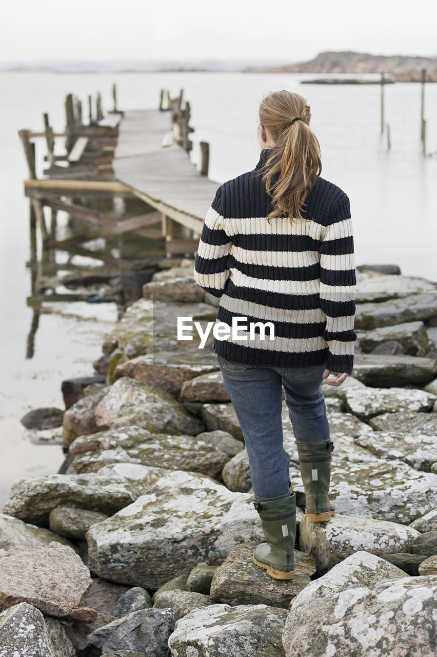 Woman walking on jetty