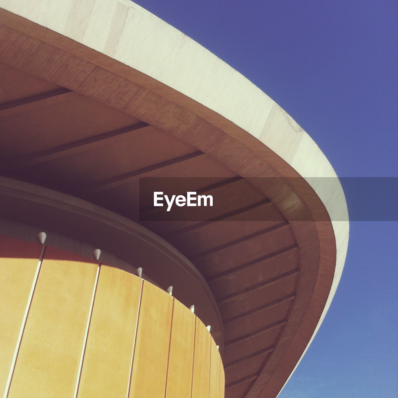 Low angle view of built structure against clear blue sky