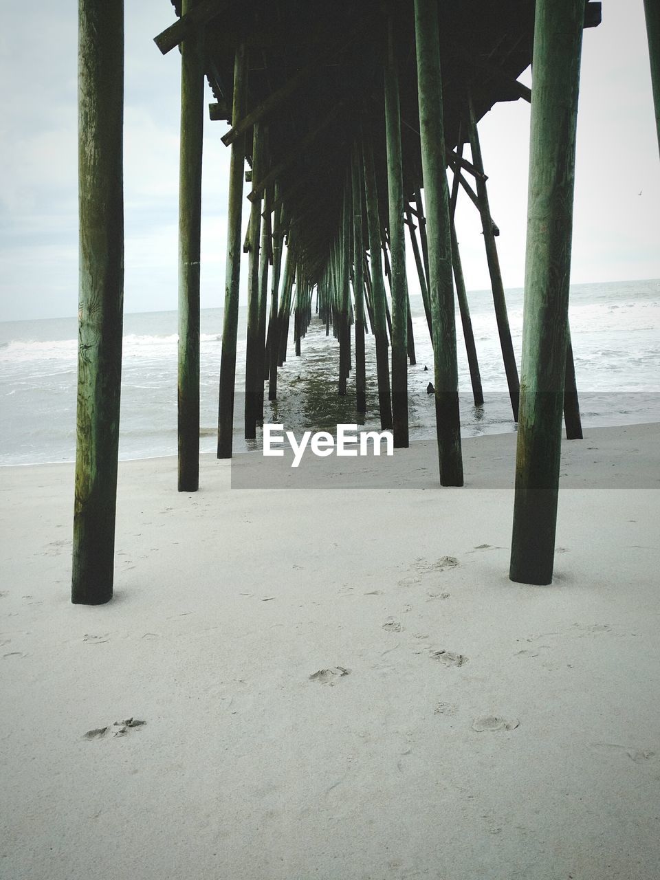 Wooden columns under a pier