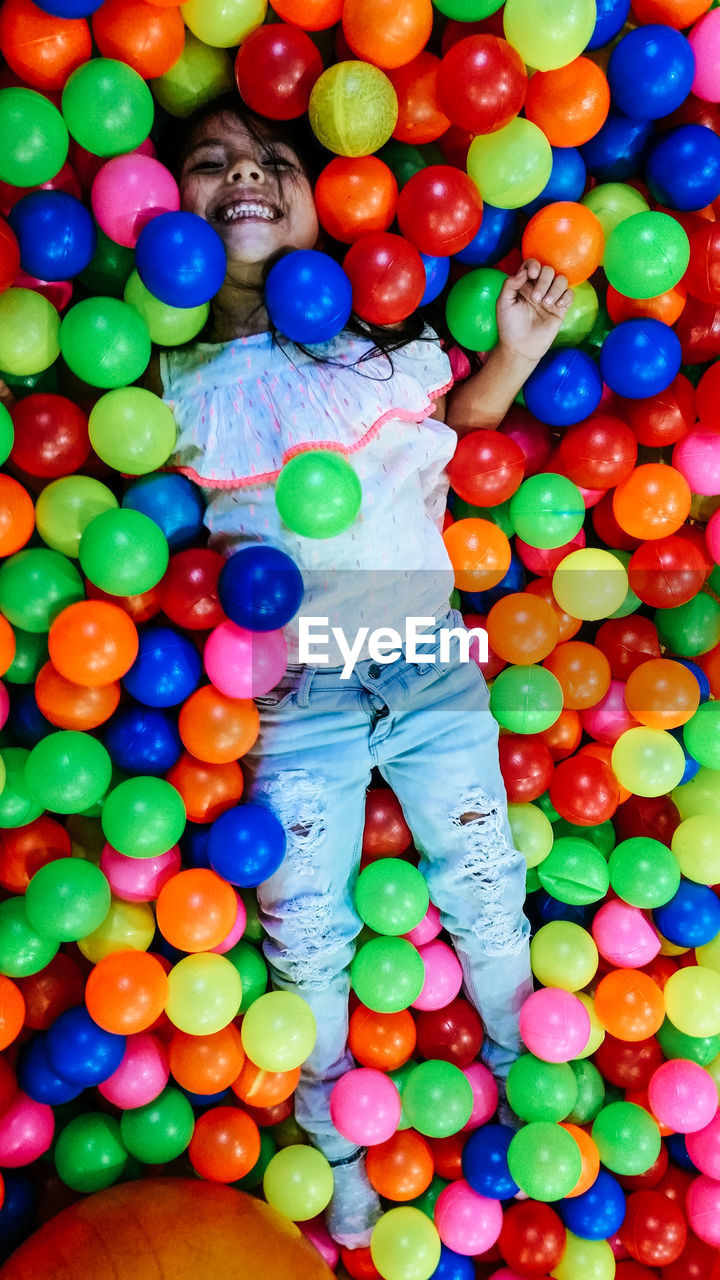 High angle view of girl in ball pool