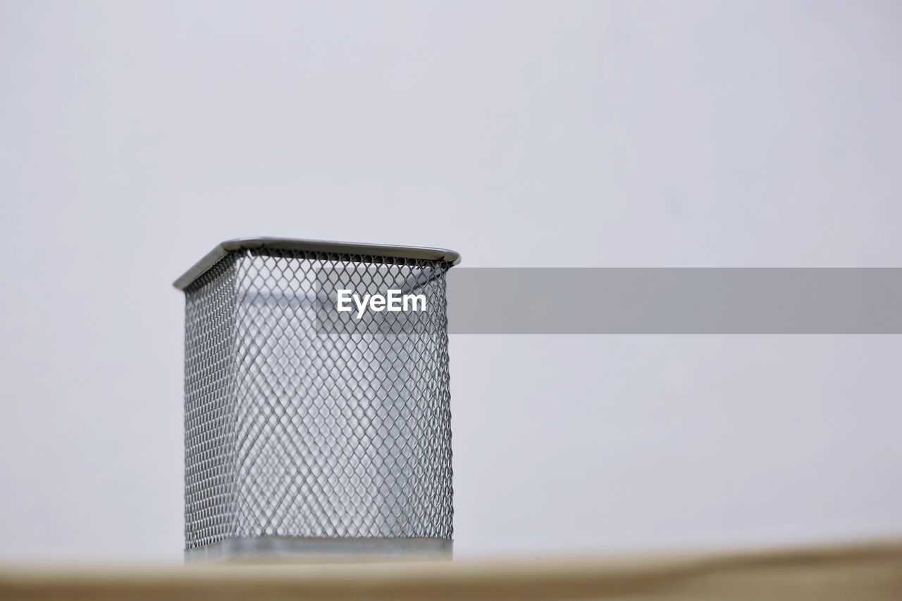 CLOSE-UP OF METAL AGAINST WALL