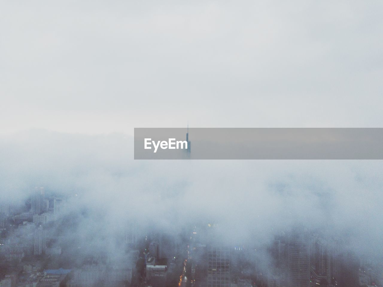 Aerial view of city buildings against sky