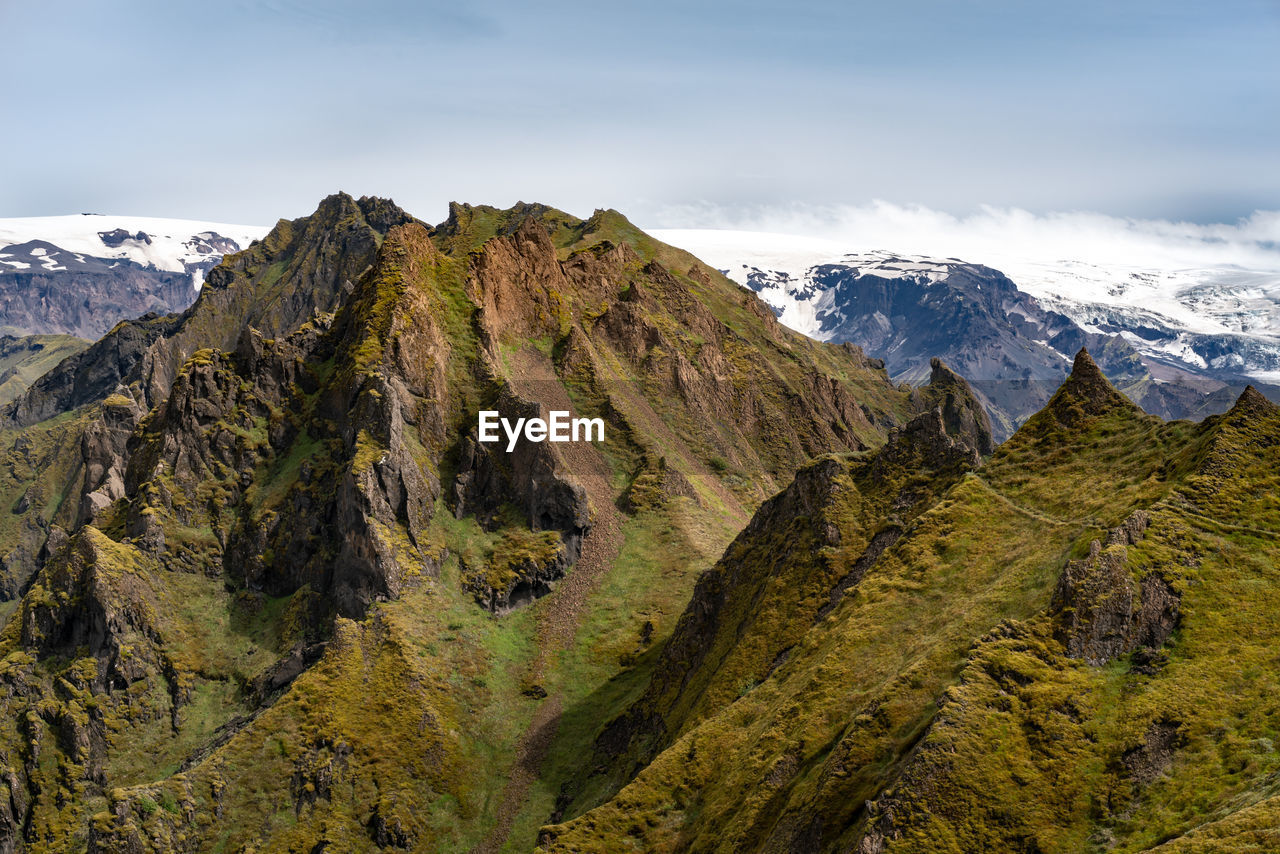 Volcano with glacier in the background on a summer day. myrdalsjokull glacier viewed from thorsmork