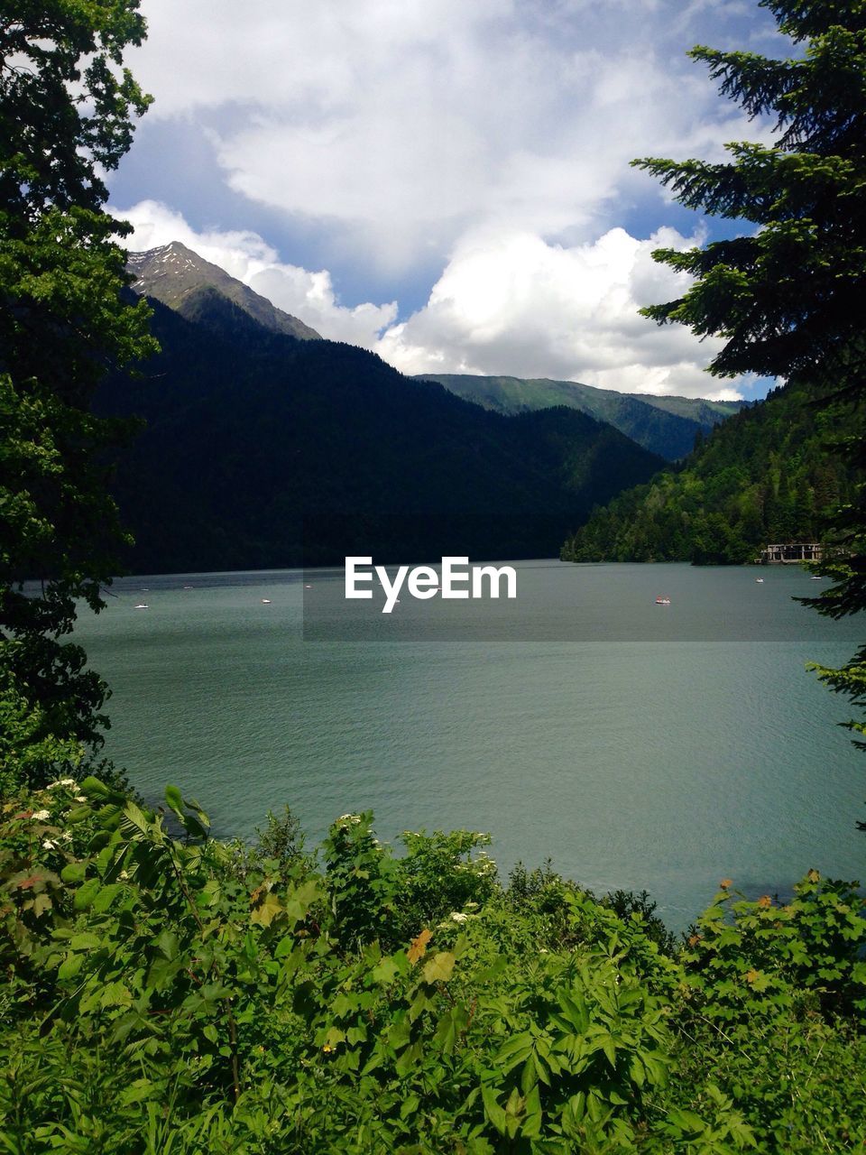 SCENIC VIEW OF LAKE AND MOUNTAINS