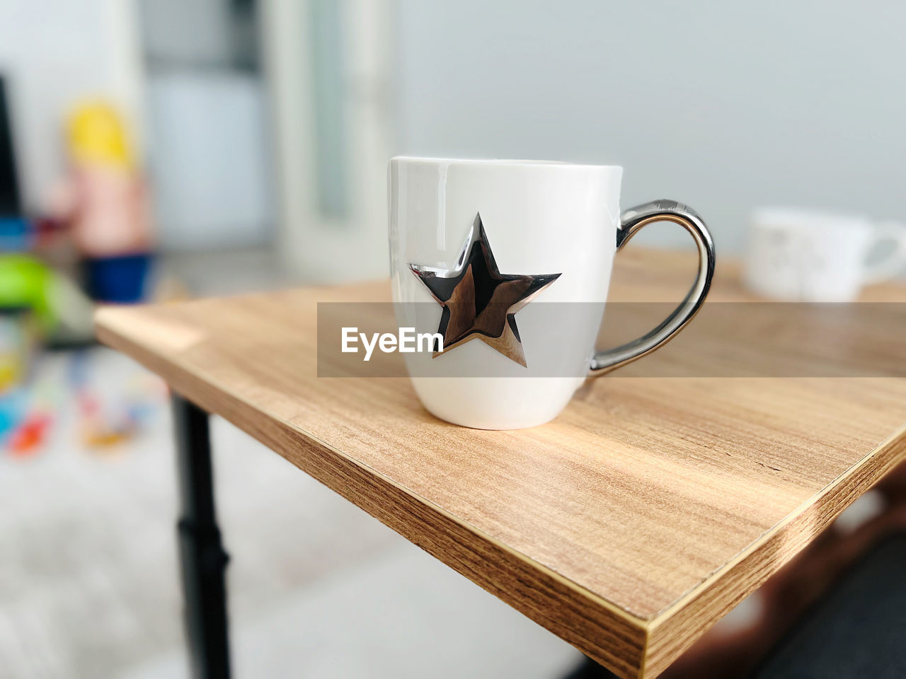 cup, table, mug, drink, food and drink, indoors, coffee cup, wood, coffee, furniture, focus on foreground, no people, refreshment, business, hot drink, still life, tea, home interior, close-up, cafe, tea cup