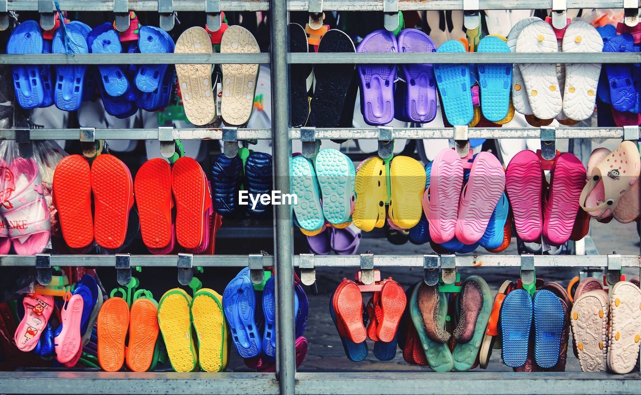 Full frame shot of footwear on rack at market stall