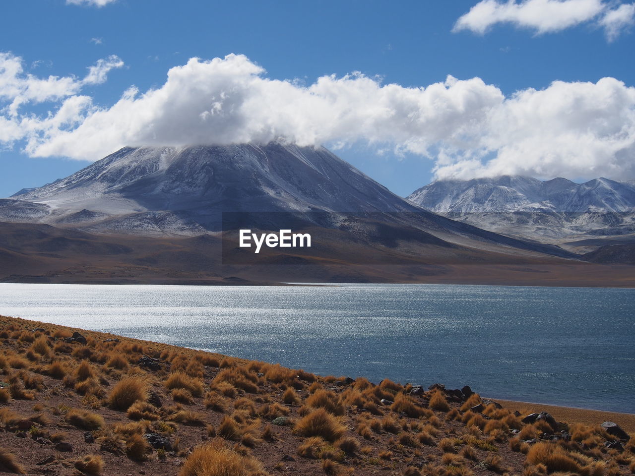 Scenic view of lake and mountains against sky