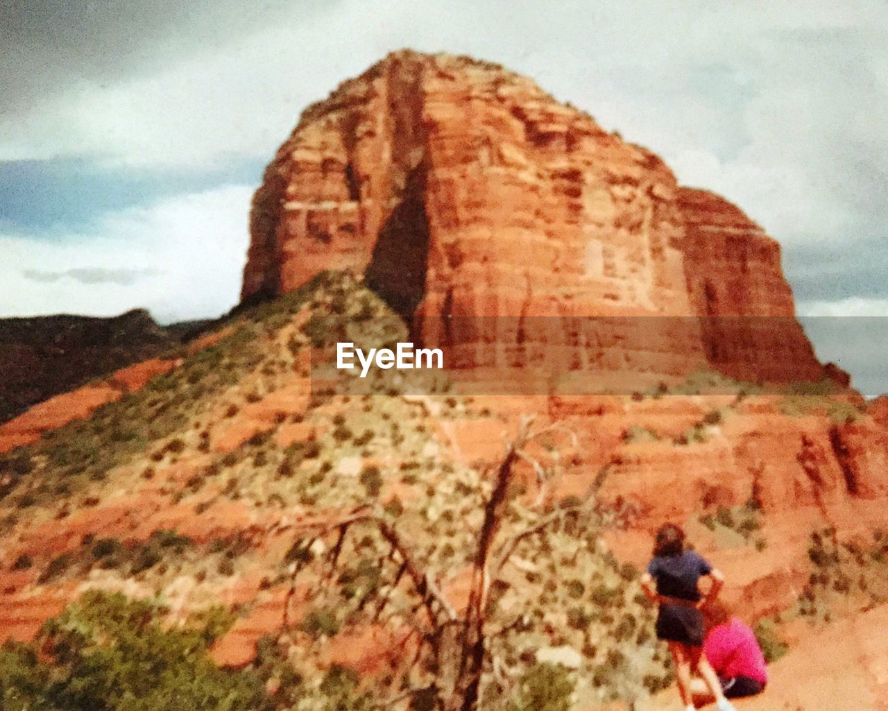 TOURISTS ON ROCK FORMATIONS