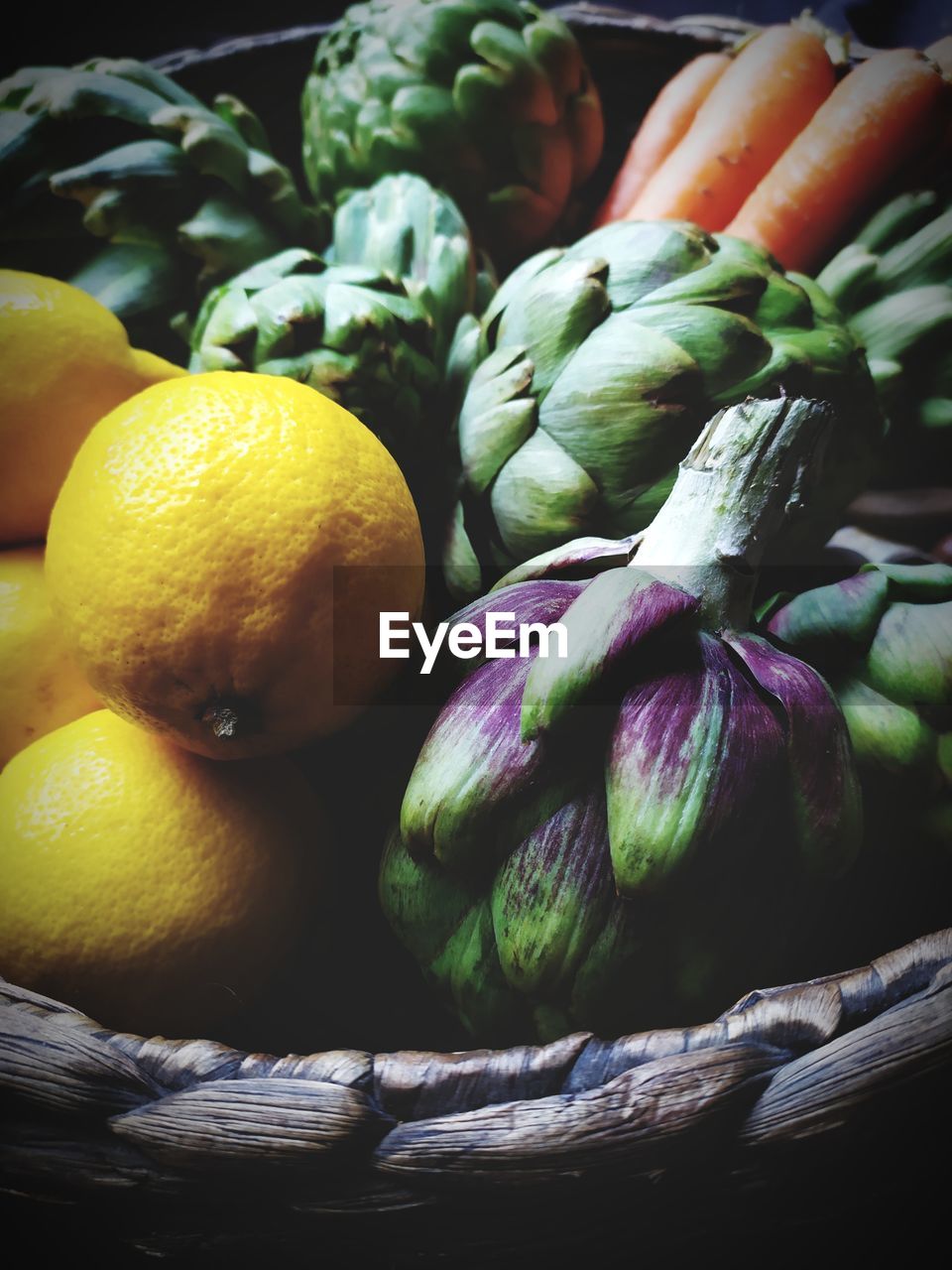 CLOSE-UP OF FRUITS IN BASKET AT MARKET STALL