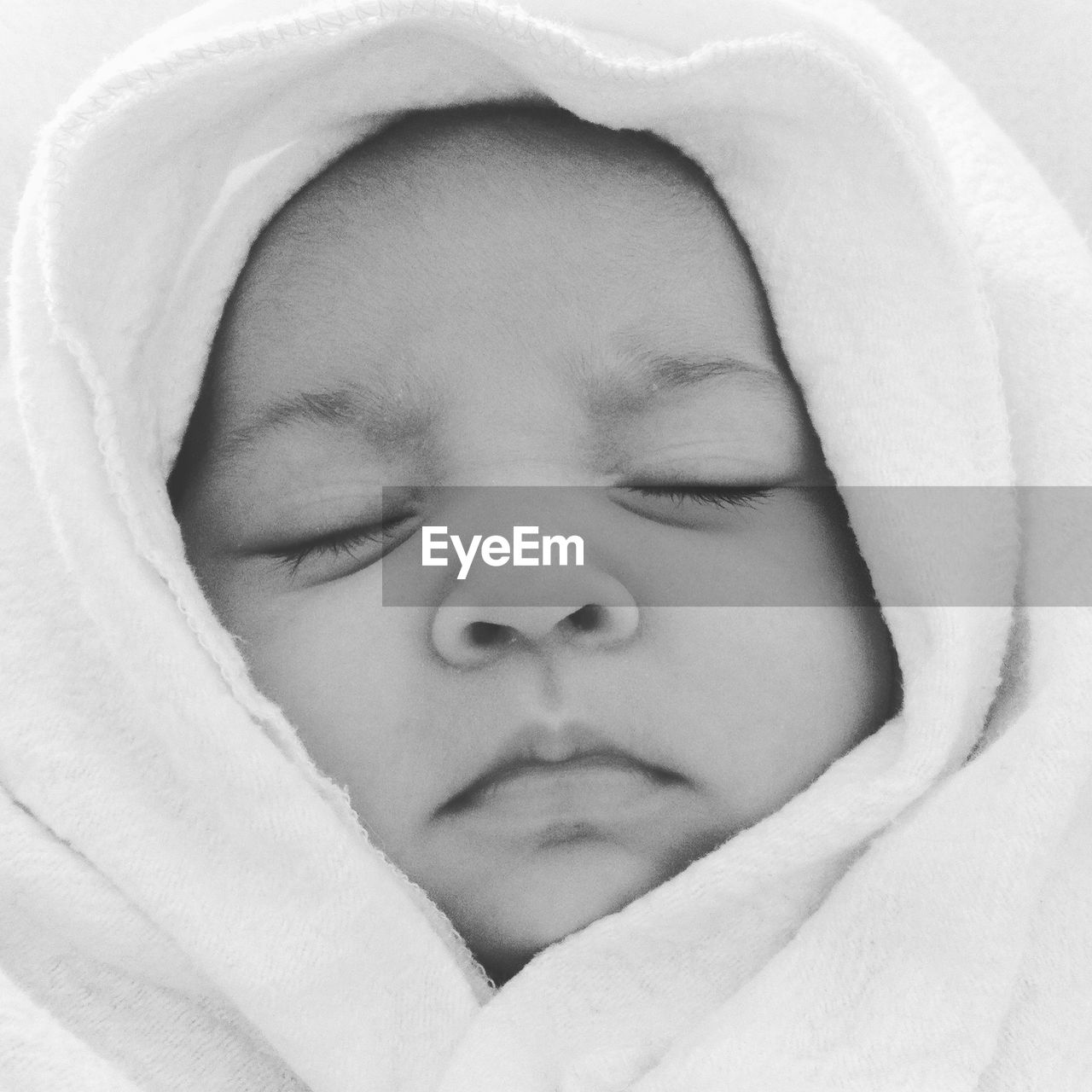 Close-up of baby girl sleeping at home