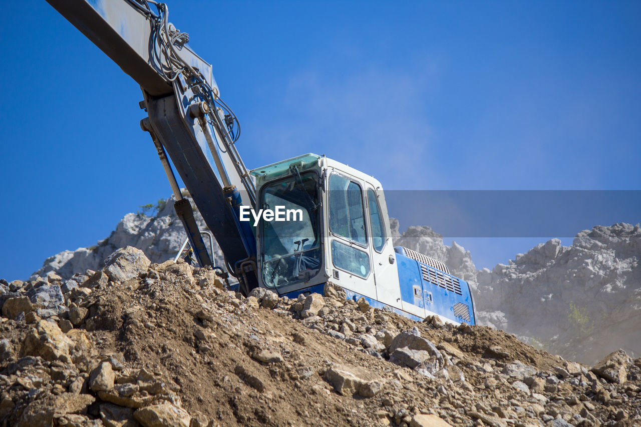 Low angle view of construction site against sky