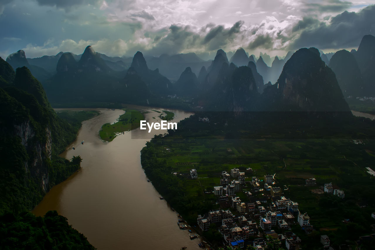 Panoramic view of river and mountains against sky