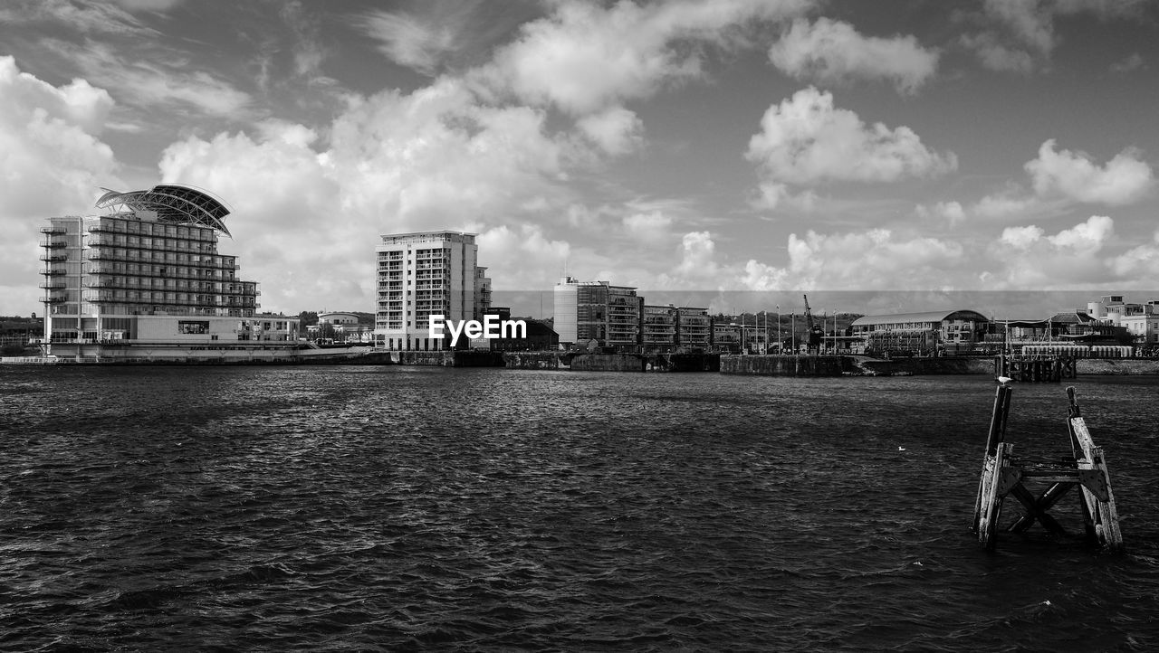 City skyline against cloudy sky