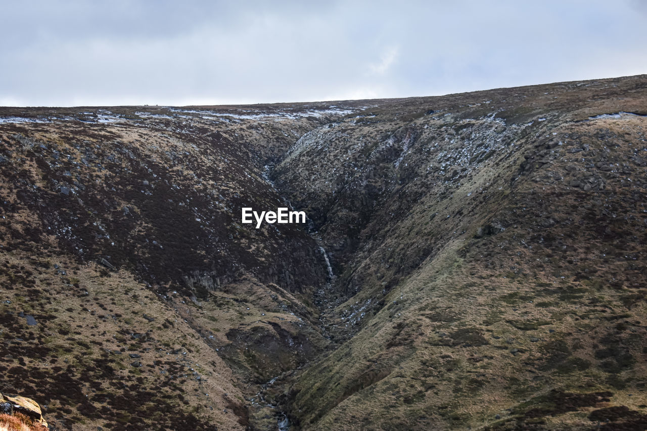 environment, landscape, rock, cloud, nature, sky, mountain, scenics - nature, beauty in nature, geology, land, non-urban scene, day, outdoors, no people, tranquility, cliff, travel destinations, tranquil scene, ridge, terrain, travel, activity, mountain range, volcano