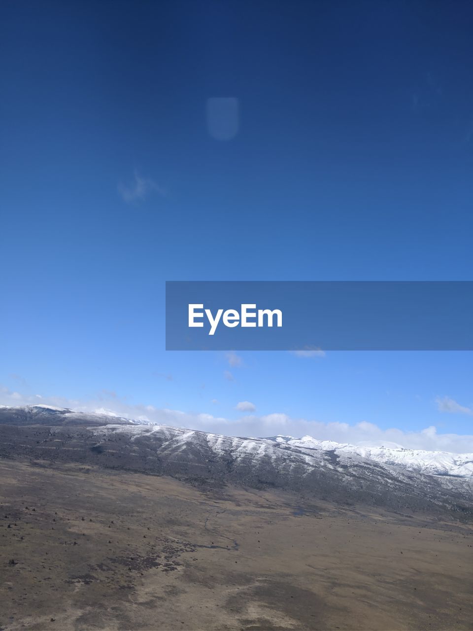 SCENIC VIEW OF SNOWCAPPED MOUNTAIN AGAINST SKY