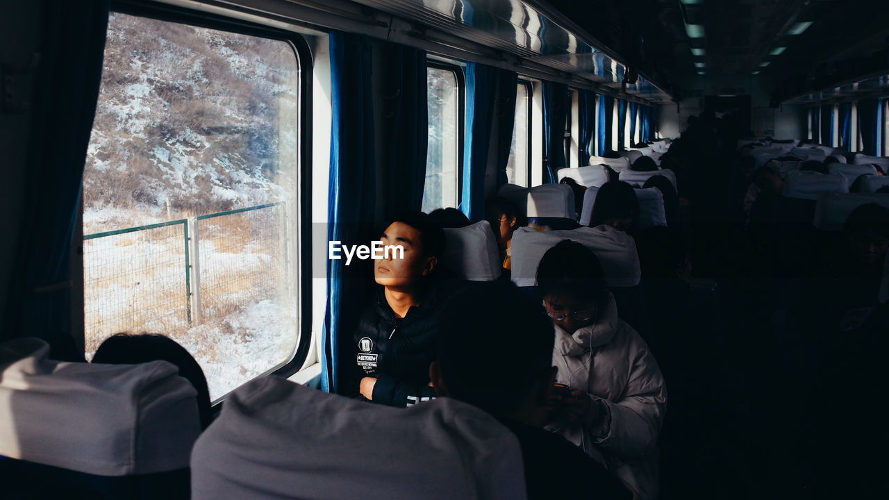 GROUP OF PEOPLE IN TRAIN