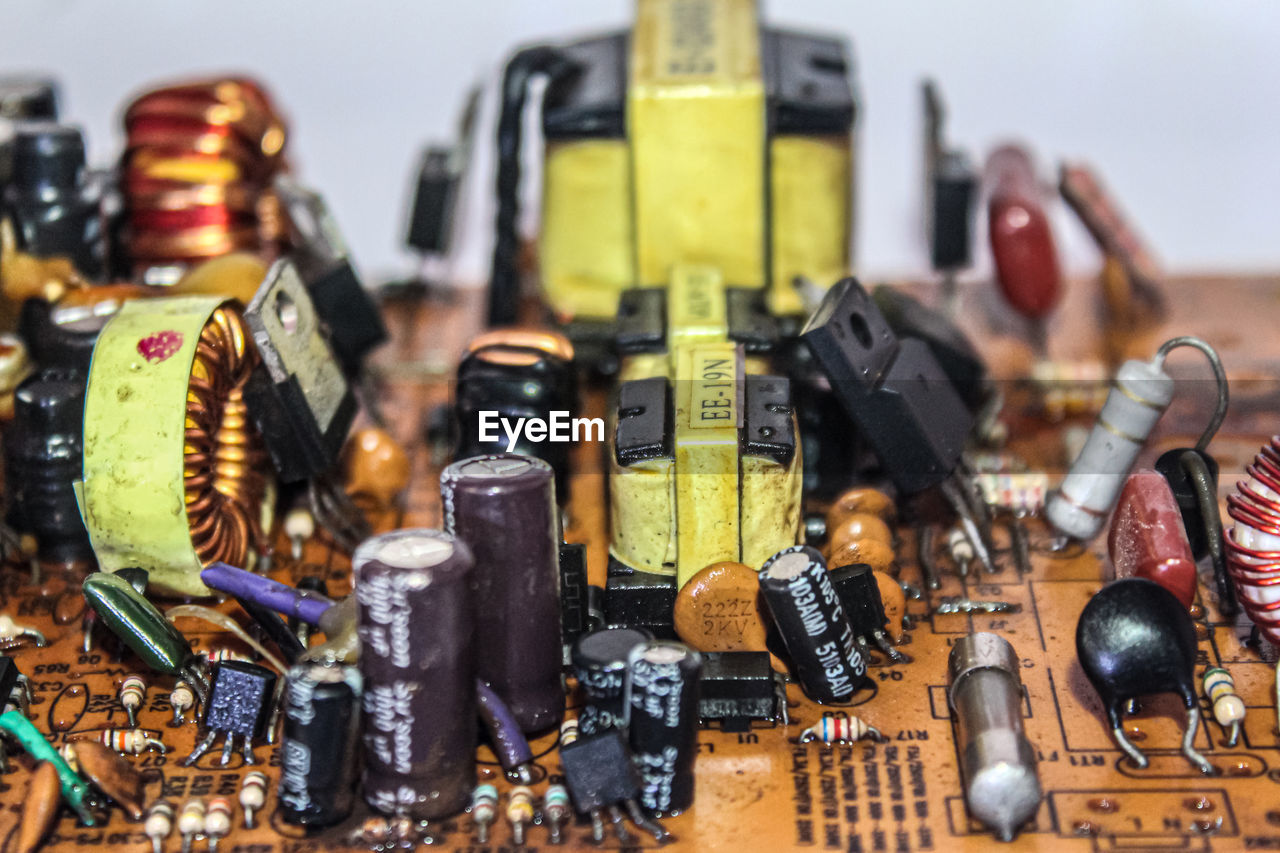 HIGH ANGLE VIEW OF TOYS ON TABLE AGAINST GRAY BACKGROUND
