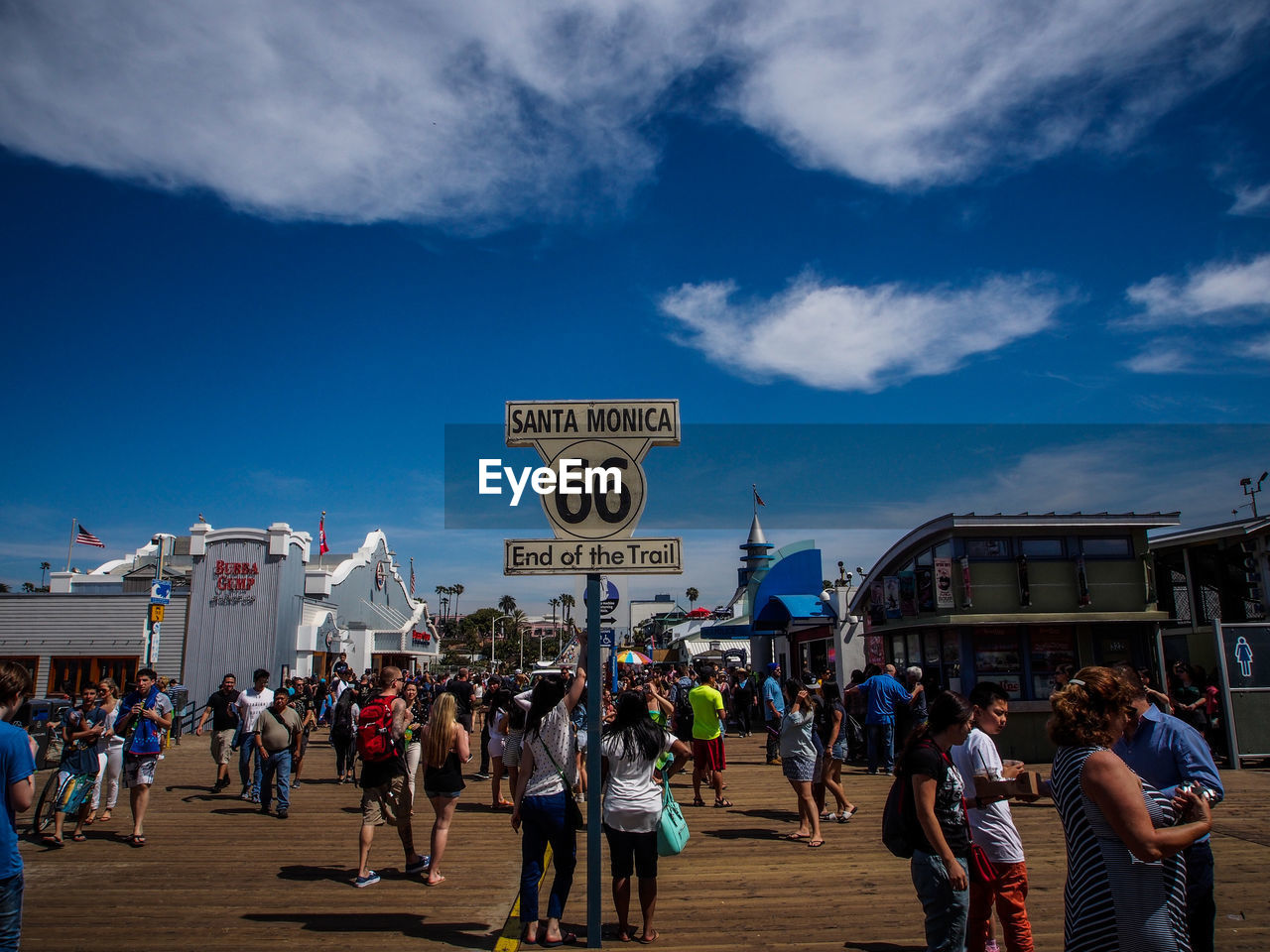 Crowd at santa monica pier against sky