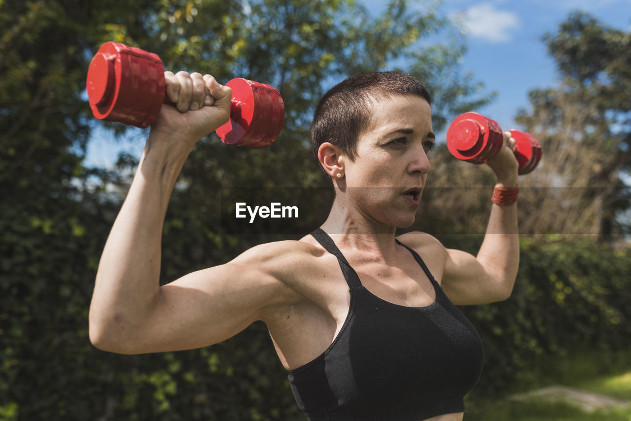 Woman training and stretching outdoors