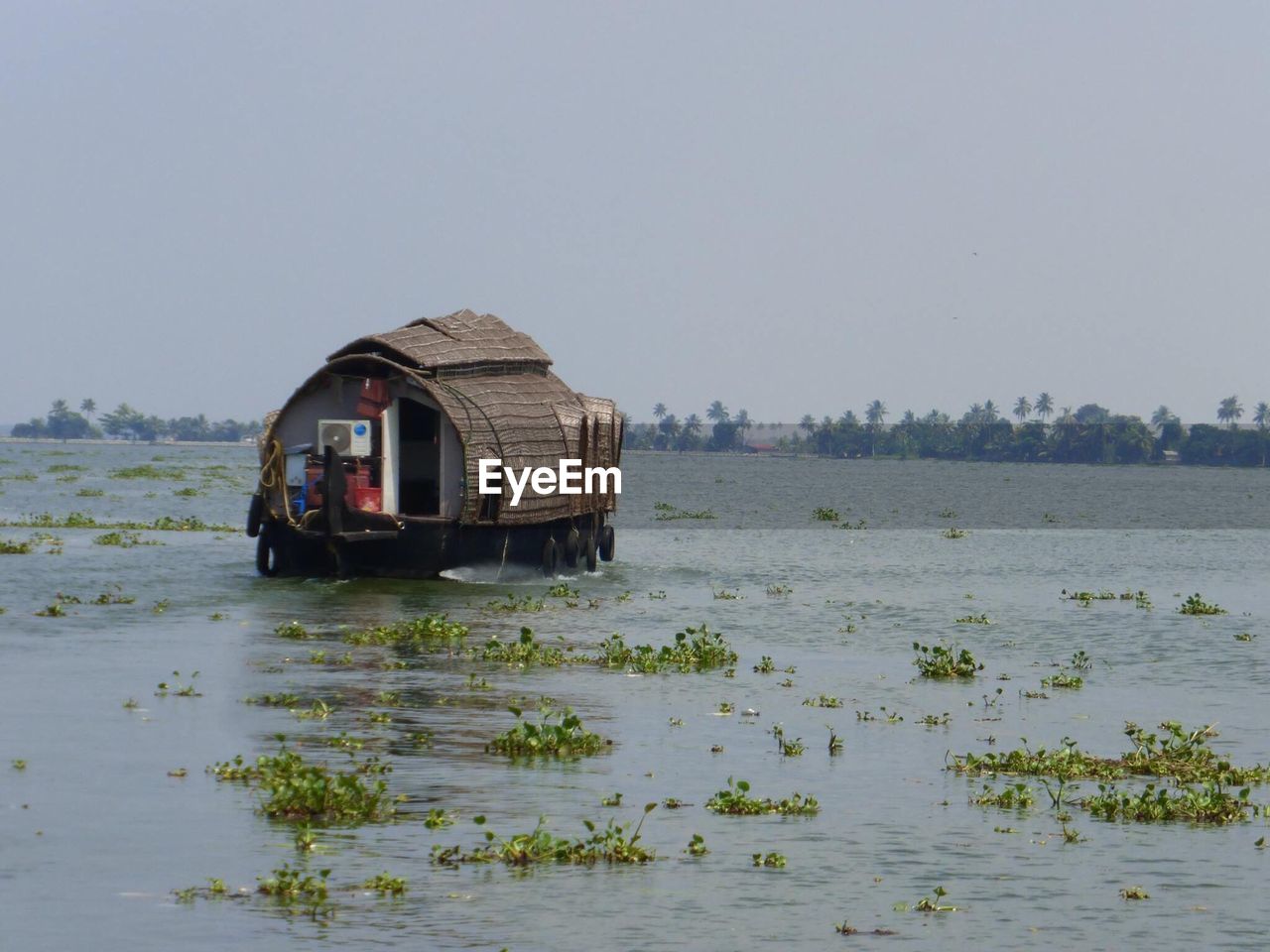 NAUTICAL VESSEL ON SHORE AGAINST CLEAR SKY