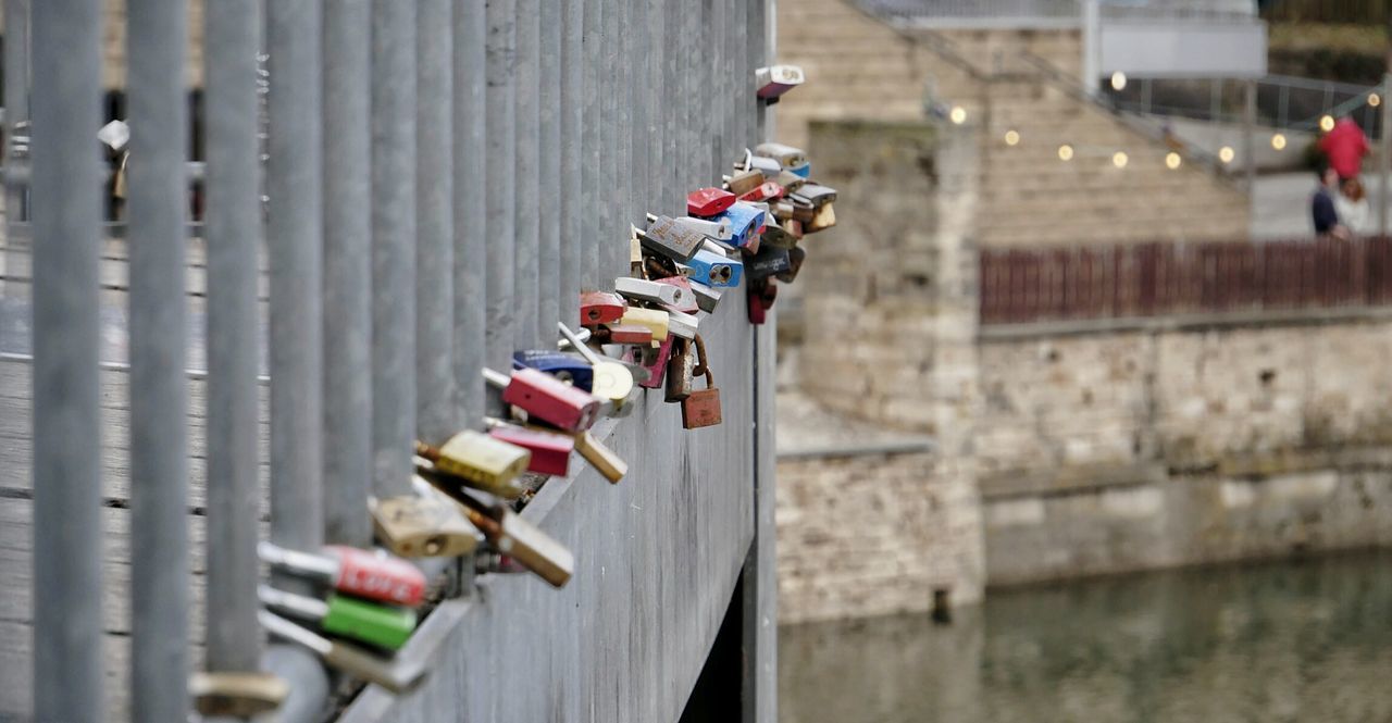 Close-up of padlocks on railing