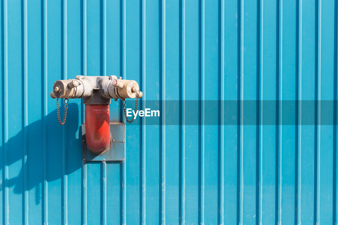 Fire hydrant on corrugated iron