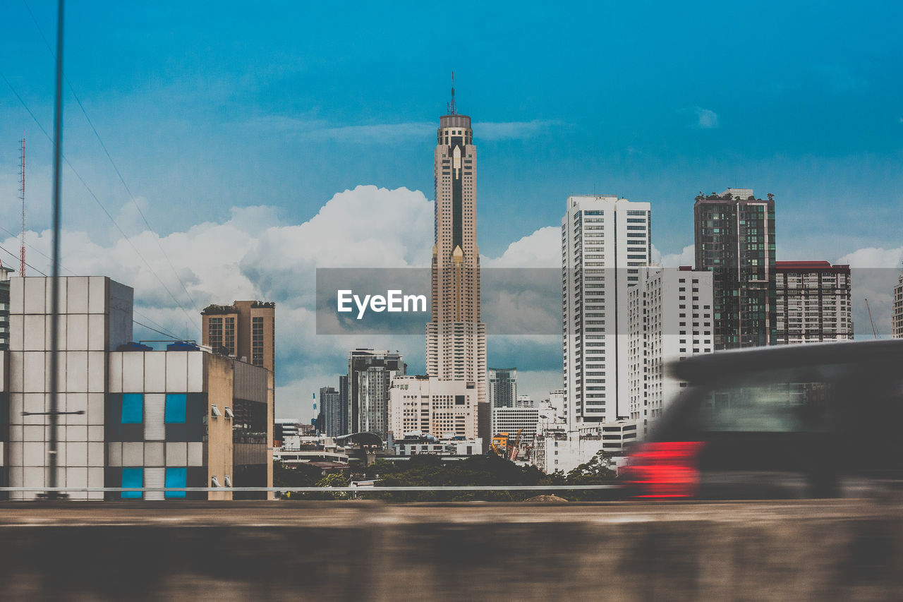 Modern buildings in city against sky