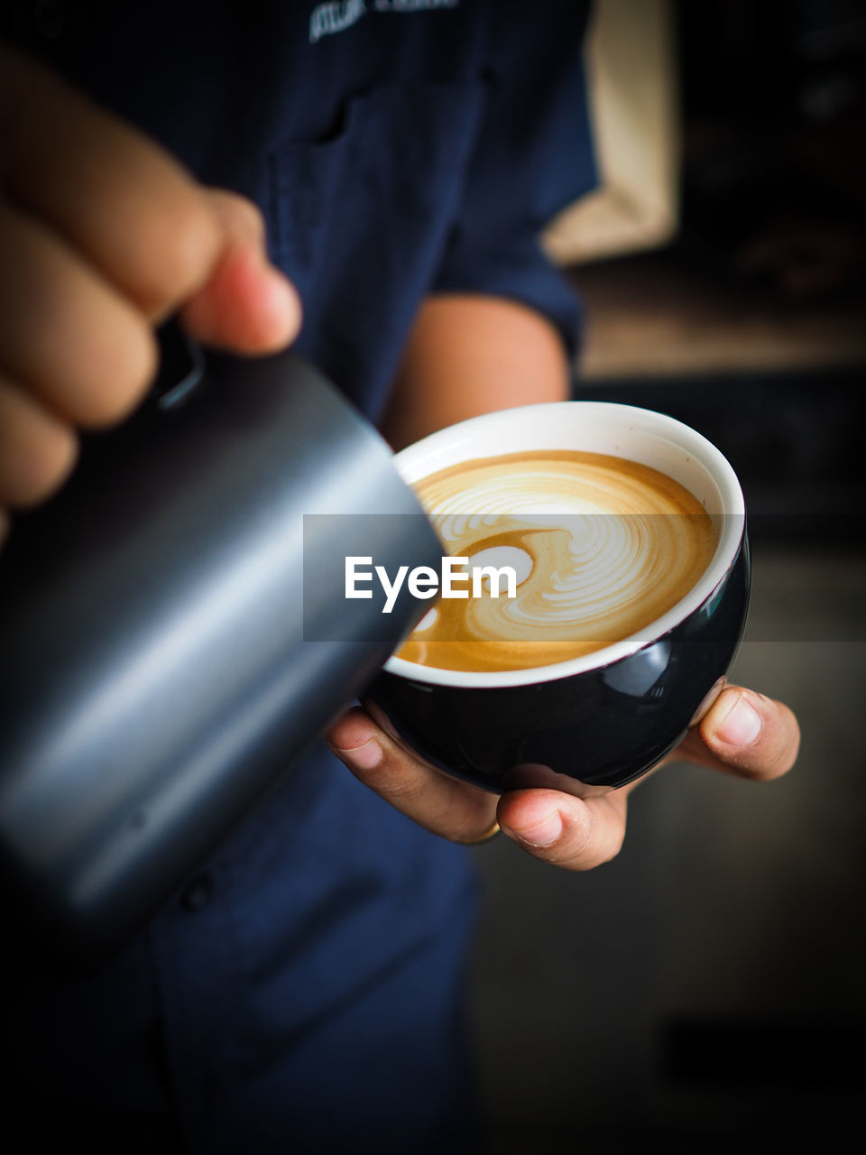 Midsection of man preparing coffee