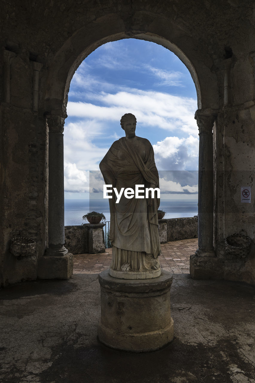 STATUE OF BUDDHA AGAINST SKY