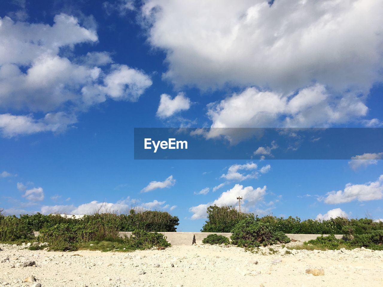 Scenic view of landscape against blue sky