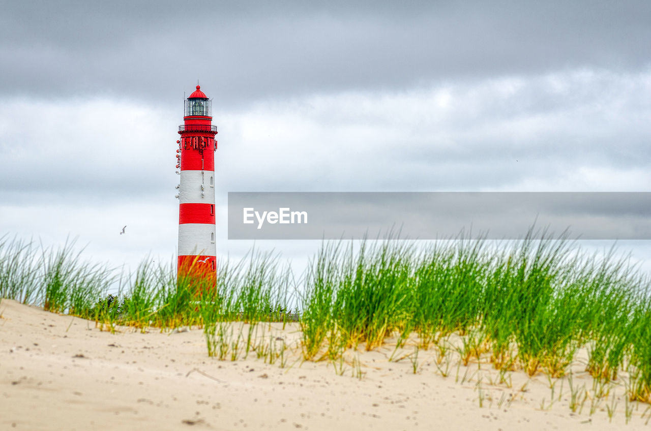 Red white lighthouse on the north sea