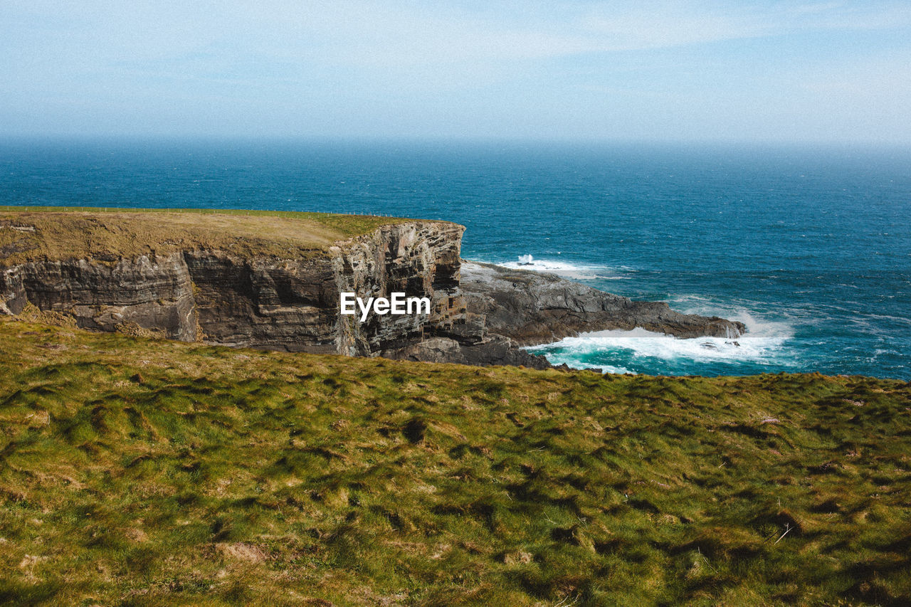 Cliffs and waves at mizen head peninsula ireland
