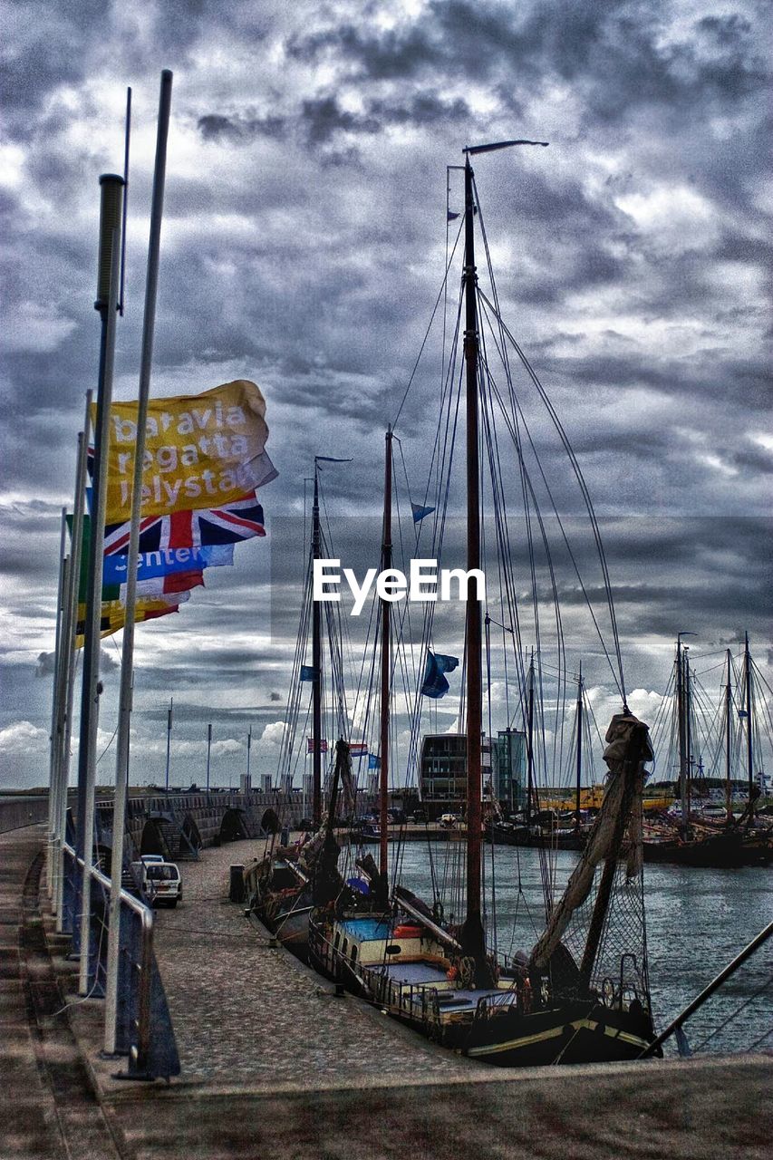 BOATS MOORED IN SEA