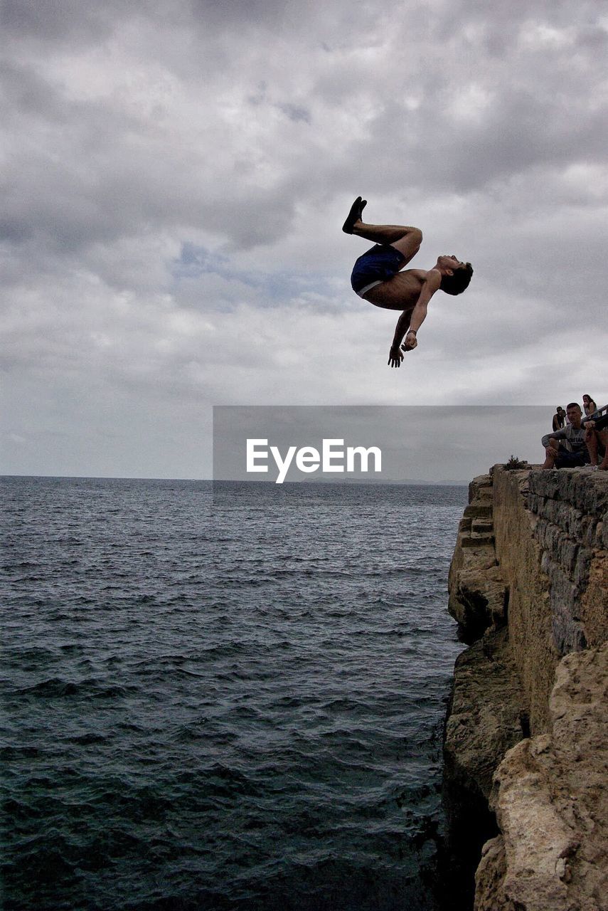 View of jumping from cliff into sea