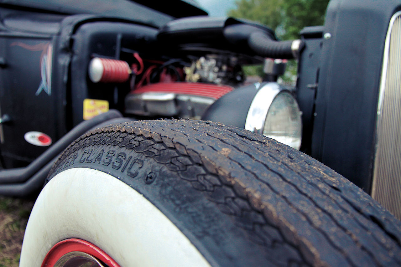 CLOSE-UP OF CAR AGAINST BLURRED MOTION