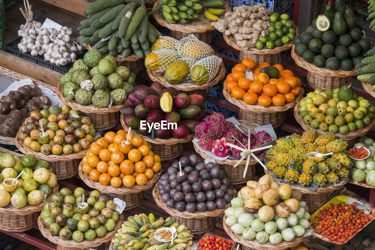 VARIOUS FRUITS FOR SALE IN MARKET STALL