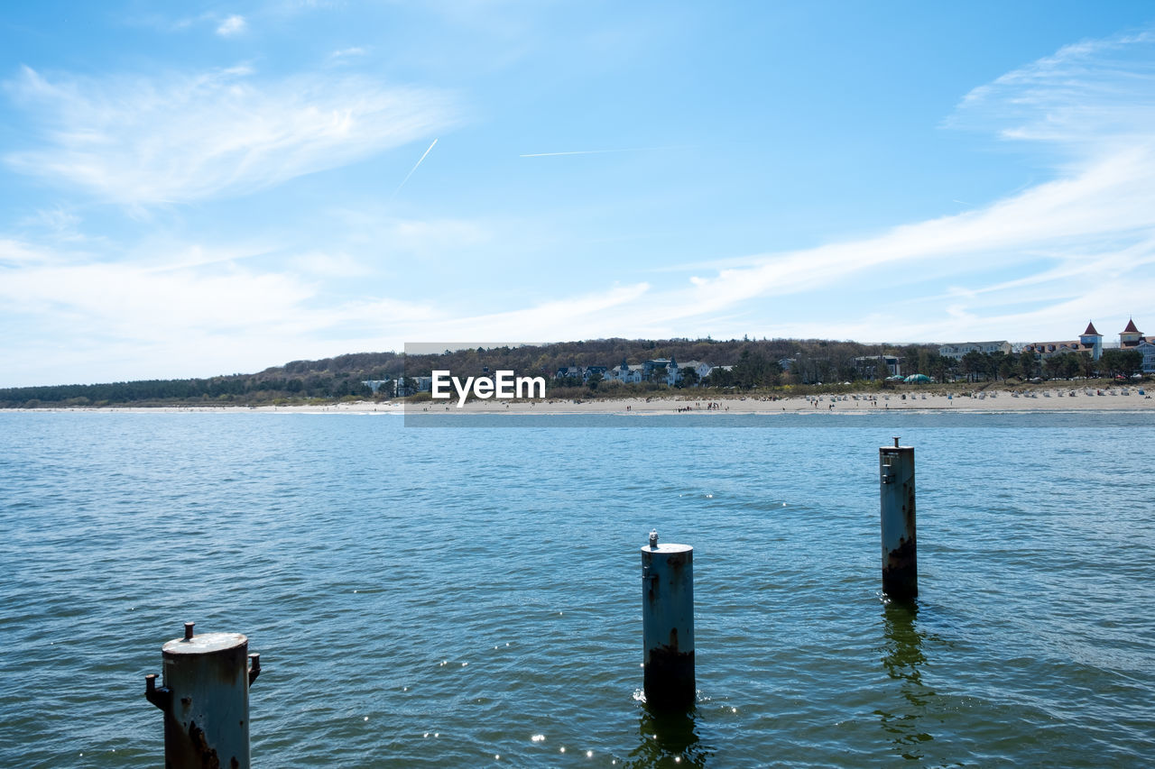 WOODEN POSTS IN SEA