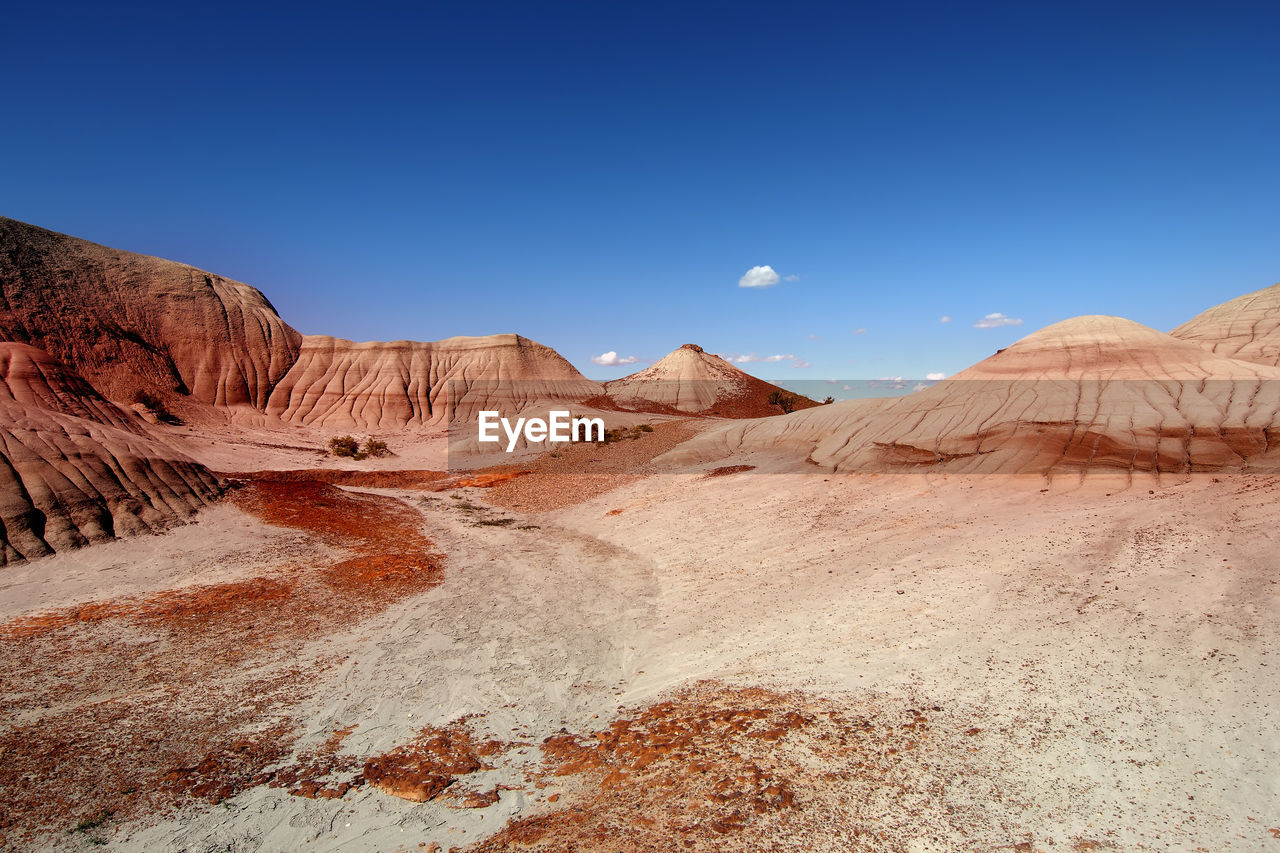 SCENIC VIEW OF MOUNTAIN AGAINST BLUE SKY